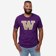 While the team racks up victories during the game, you can rack up the style points everywhere you go. All you need is this Washington Huskies Primary Logo T-Shirt. Look good, feel good, and get ready to let everyone know that you’re the MVP of fan fashion. This top features a design that showcases your all-important team colors and a bold team logo display across the chest, meaning this tshirt will prove your unmatched dedication to the Washington Huskies when you’re at the game or watching at Purple College T-shirt With Team Name, Purple Crew Neck T-shirt For Sports, Purple Crew Neck Top With Team Name, Sporty Purple T-shirt With Team Name, Sports T-shirt Purple With Logo Print, Purple Crew Neck T-shirt With Team Name, Purple Tops With Team Name For Fan Gear, Varsity Crew Neck T-shirt For Fan Gear, Purple Fan Gear Tops With Team Name