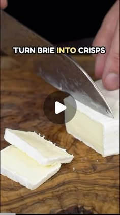 a person cutting cheese with a knife on top of it and the words turn brie into crispes