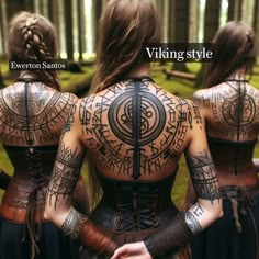 three women with tattoos on their back are looking at each other and the words viking style written in cursive writing