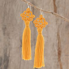 Carrying an antique aesthetic, these luxurious dangle earrings are created by Guatemalan artisan Gladys Pichola. She utilizes traditional tatting techniques, where she diligently crochets the earrings of nylon thread, featuring a sunny marigold color. An elegant tassel dangles from each earring, which is suspended from a sterling silver hook. Marigold Color, Hand Tats, Antique Aesthetic, Lace Earrings, Bold Earrings, Pumpkin Colors, Fall Earrings, Pearl Earrings Dangle, Pretty Earrings