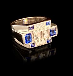 Art Deco Stle Sapphire And Diamond Ring. Beautifully stylish ring set with baguette cut diamonds and sapphires. Bold, eye catching in appearance this ring has eternal style. Comes complete with a IGR gem report for buyer confidence. Stamped Platinum Weight 8.7 grams Size N Video available on Youtube https://youtu.be/V1SWM2FTGHs Modern Blue Rings With Baguette Diamonds, Modern Multi-stone Sapphire Ring With Diamonds, Modern Multi-stone Baguette Cut Rings, N Video, Art Deco Christmas, Deco Christmas, Victorian Bracelet, Citrine Bracelet, Baguette Diamond Rings