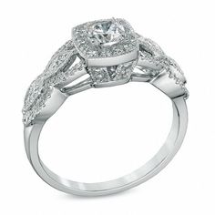 Capture the romance of the day with this vintage-inspired Celebration Ideal diamond engagement ring. Crafted in 14K white gold, this dazzling design showcases a 1/3 ct. Celebration Canadian Ideal diamond with a color rank of I and clarity of I1. The ideal cut of this diamond is designed to brilliantly enhance sparkle and shine. Additional diamonds create a cushion-shaped border and line the ring's marquise frame and milgrain-detailed split shank. Compelling with 3/4 ct. t.w. of diamonds and a bright polished shine, this comfort-fit engagement ring is a keepsake. Due to the nature of pre-owned jewellery, the ring you choose may have been previously sized. Ring styles from our pre-owned jewelry inventory are sold at their current size and cannot be resized at purchase. As this inventory cons Ring Styles, Alternative Metal, Split Shank, Showcase Design, Diamond Stone, Stone Settings, Diamond Engagement Ring, Metal Jewelry, Ring Designs