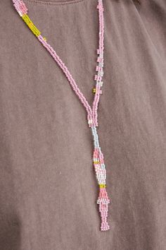 Pullover beaded necklace 16" drop, 24" opening One of a kind Made of glass beads Lift over head with care Handmade in Boulder, CO Designer: Salihah Moore | Learn more about the Designer and shop the collection. Long Pink Necklace With Large Beads, Pink Long Necklace With Large Beads, Pink Large Beaded Long Necklace, Lariat Necklace With 108 Beads, Pink Long Beaded Necklace, Salihah Moore, Boulder Co, The Collection, Unique Pieces