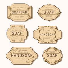 four soap labels with leaves and branches on the top one is labeled hand soap, two are