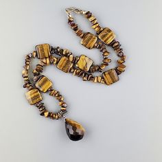 Tiger's Eye Beaded Necklace with Tiger Pendant Brown Beaded Pendant Jewelry, Brown Faceted Beads Dangle Jewelry, Elegant Brown Beaded Gems And Cabochons, Beaded Brown Gems And Cabochons For Jewelry Making, Brown Single Strand Round Bead Jewelry, Tiger Pendant, Wedding Necklaces, Tigers Eye Necklace, Tiger Eye Beads