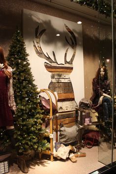 two mannequins dressed as santa claus and reindeer