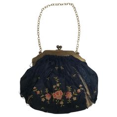 Elevate your style with this exquisite antique hand-embroidered silk purse dating back to 1910, a true testament to the craftsmanship of a bygone era. The intricate embroidery on the silk fabric reflects the artistry and attention to detail that was characteristic of the time. This timeless piece not only serves as a fashion statement but also carries with it a rich history. Embrace a touch of vintage elegance with this Frank 1910 antique silk purse, a unique accessory that transcends trends and Victorian Bag, Silk Purse, Tambour Embroidery, Vintage Elegance, Bygone Era, Intricate Embroidery, Chain Stitch, Embroidered Silk, Elevate Your Style