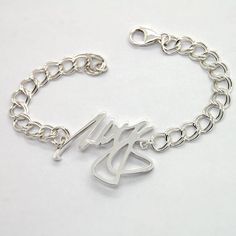 Sturdy sterling silver bracelet is a great personalized gift for men. Order your own message for this custom made bracelet, it will be made in a comfortably curved central piece with hefty chain and large lobster clasp. Depends on what you would like it to say, sterling silver center will be 1.5-1.8 in wide and 2.4mm thick - they are cast, not cut out of the metal sheet, which gives them extra sturdiness. If you would like to use handwriting, just send me a picture of it attached to the Etsy mes Personalized White Gold Sterling Silver Bracelet, Sterling Silver White Gold Bracelet With Name, Silver Name Bracelet With Polished Finish As Gift, Silver Name Bracelet With Polished Finish, Customized Silver Name Bracelet For Personalized Gift, Personalized Name Sterling Silver Bracelet, Personalized Name Bracelet In Sterling Silver, Sterling Silver Signature Jewelry For Personalized Gift, Classic Silver Bracelet With Custom Name