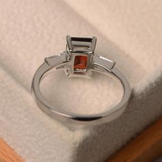 Natural garnet ring promise ring emerald cut red gemstone | Etsy Emerald Cut Ruby Ring Gift, Silver Topaz Ring With Rectangular Stone For Promise, Garnet Emerald Cut Promise Ring, Silver Emerald-cut Emerald Ring As Gift, Silver Emerald Ring With Rectangular Stone For Gift, Emerald Cut Ruby Ring With Accent Stones As Gift, Emerald Cut Garnet Promise Ring, Elegant Silver Emerald Ring With Rectangular Stone, Elegant Garnet Rings In Rectangular Shape