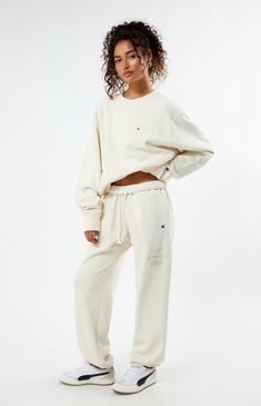 PacSun exclusive! Elevate your loungewear game with the Champion x PAC 1980 Sweatpants, designed for comfort and style. Featuring a high-rise fit with an interior drawstring waistband, side hand pockets, and elastic ankle cuffs, these sweatpants offer a cozy yet tailored look. Complete with a soft-touch PacSun graphic and iconic Champion logo C embroidery, they're the perfect blend of fashion and function for your everyday wardrobe.


	Solid color sweatpants
	High-rise
	Interior drawstring waistband
	Side hand pockets
	Champion C embroidery
	PacSun graphic
	Elastic ankle cuffs
	82% cotton, 18% polyester
	Machine washable
	Model is wearing a size medium
	Model measurements: 5’6” height, 30” bust, 25.5” waist, 36.5” hip Sportswear Lounge Pants With Drawstring, Sportswear Lounge Bottoms With Drawstring, Sportswear Loungewear Bottoms With Drawstring, Drawstring Sportswear Bottoms For Loungewear, Drawstring Bottoms For Loungewear Sportswear, Drawstring Bottoms For Loungewear, Champion Sweatpants Outfit, Sweatpants Aesthetic, Patchwork Sweatpants