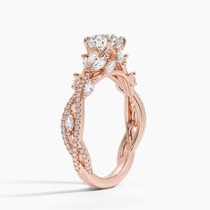 a rose gold engagement ring with diamonds on it