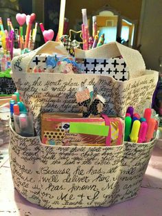 a bag filled with lots of writing on top of a table