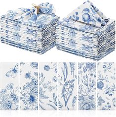 a stack of blue and white napkins on top of each other with different designs