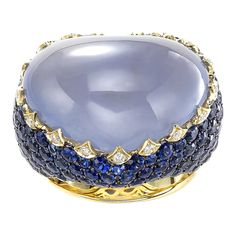 One of a kind large heart shape cabochon chalcedony gemstone, round sapphire and diamond ring in 18k yellow gold. Ring contains 1 center heart shape chalcedony 18.75ct. Center stone is accented by round sapphires, 5.53tcw and round brilliant diamonds, 0.17tcw. Ring is a size 6.75 and can be resized to desired measurement. Please contact us. All of our pieces are packaged carefully and accompanied by a Pico box to keep your jewelry item safe. A complimentary appraisal can be sent after 5 days of purchase via air mail or email; please inquire. Purple Chalcedony, Gold For Sale, Chalcedony Ring, Round Sapphire, Sapphire And Diamond Ring, Sapphire Diamond Ring, Sapphire Diamond, Pink Sapphire, Cocktail Rings