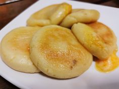 some food is sitting on a white plate