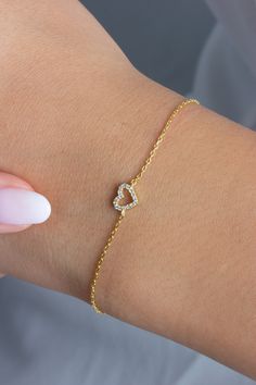 This 14k diamond heart bracelet is a symbol of love. Perfect for layering or to gift someone special.  M A T E R I A L & L E N G T H Available in 14k Yellow Gold, 14k Rose Gold, 14k White Gold Stone: Natural Diamond Heart Measurements: 11 mm x 9 mm Diamonds: .10 ct tw Bracelet length: 6+1 inches (Please let us know if you prefer a different length) Color: G  Quality: SI-VS Additional Notes: * Non-Conflict Diamonds * Made in the USA E X C H A N G E / R E T U R N ∙ P O L I C Y Please let us know within 7 days of receipt. Ship the item back to us in its original condition. Get a full refund. Personalized items can be exchanged with 20% restocking fee. Full eternity bands can be exchanged with 15% restocking fee. Azalea Jewelry will cover return shipping cost if there is an issue with the item Bracelet Fancy, Bracelet Dainty, Wedding Jewelry Bracelets, Gold Diamond Jewelry, Initial Bracelet, Special Jewelry, Gold Stone, Bezel Diamond, Love Symbols