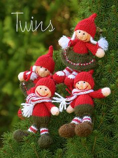 three knitted christmas elves hanging from a tree branch with the words twins above them