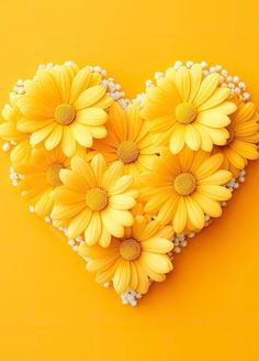 yellow daisies arranged in the shape of a heart on an orange background with pearls