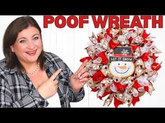 a woman holding up a christmas wreath with a snowman on it and the words, poof wreath