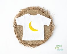 Just like our Yellow Banana Baby Tee but with some silly googly eyes! (The googly eyes are printed, not 3-D, so there is no chance of them falling off!) Baby's first steps should be done with style, and this crew neck t-shirt is here to help. For children--it's super-soft and comfortable. For parental figures--it's shrink-resistant and durable. All of that is made possible with the pre-shrunk, 100% airlume combed and ringspun cotton (Athletic Heather: 90/10 airlume combed and ringspun cotton-polyester blend; Additional Heather colors: 52/48 airlume combed and ringspun cotton-polyester blend). .: 100% airlume combed and ringspun cotton (fiber content may vary for different colors) .: Light fabric (4.2 oz/yd² (142 g/m .: Regular fit .: Tear-away label Playful White T-shirt With Smiley Face, Playful Summer T-shirt With Funny Text, Playful Short Sleeve T-shirt As Gift, White Playful T-shirt With Smiley Face, White Smiley Face T-shirt, Summer Cartoon Print T-shirt For Gift, Summer Cartoon Print T-shirt As A Gift, Funny White T-shirt With Smiley Face, Summer T-shirt With Cartoon Print For Gift