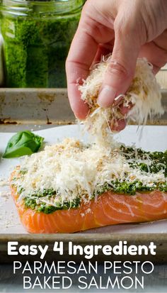 someone is grating parmesan cheese on top of salmon