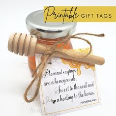 a jar of honey with a wooden stick and tag on it that says, printable gift tags