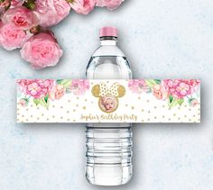 a water bottle label with a minnie mouse face on it and pink flowers in the background