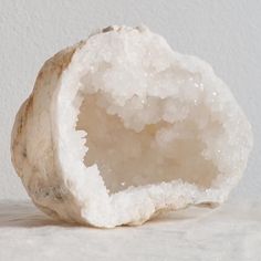 a piece of white rock sitting on top of a table