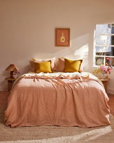 a bed with two pillows on top of it