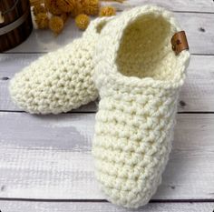 "Keep your toes toasty warm with these thick cozy handmade socks. Crocheted from a bulky soft yarn, they are sure to be the warmest coziest slippers your feet have ever been in.  Slippers are Unisex and are a perfect gift for yourself or someone in your life who needs some extra cozy comfort. They are great for wearing at home or for packing in your bag to bring along when visiting friends or family.  These bulky indoor socks are super stretchy and won't cause constriction of your feet but will keep their shape as well.    ITEM DETAILS:   * Handmade with a soft bulky acrylic yarn which is a great option to wool slipper * Available in 20 colours  * Option of 4 different size  * Handcrafted in a hygienic enviorment at my cozy farm in small town Saskatchewan  * Fully washable for easy care * Cozy Crochet Slippers For Winter, Comfortable Crochet Yarn Slippers, Cozy Yarn Slippers With Round Toe, Cozy Closed Toe Slippers, Cozy Knitted Yarn Slippers, Knit Slipper Socks, Easy Crochet Slippers, Cozy Slippers, Handmade Socks