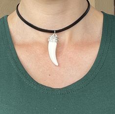 Bone Tusk Necklace - Leather Necklace - Tooth Necklace - Punk Necklace - Goth Choker - Leather Choker - Gothic Choker - Black Choker  Size of the pendant is 2.3 inch / 6 cm Material: Genuine leather, plastic Available lengths for the cord:  14 inch / 35 cm 15 inch / 38 cm 16 inch / 40 cm  17 inch / 43 cm  18 inch / 45 cm Free gift box: You will receive this necklace in a beautiful gift box with cushion inside! Let me pleasantly surprise your loved ones on your behalf if it's a gift! If you need a special handmade jewelry - something unique or just have a question/comment just contact me via Etsy message. Love, Maria Handmade Adjustable Alternative Jewelry, Handmade Alternative Jewelry For Festivals, Alternative Handmade Necklace For Gift, Handmade Adjustable Grunge Jewelry, Alternative Style Choker Jewelry Gift, Alternative Adjustable Necklace For Festivals, Tusk Necklace, Gothic Choker, Punk Necklace