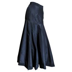 A beautiful black silk taffeta skirt from Angelo Tarlazzi. It has a grosgrain waistband and vertical panels semi fitted though to the hips then flaring to the hem. The skirt has grosgrain around the hem also and it is unlined with a center back zipper and a button at the waist. Fits Extra Small, Small. Waist 25" Hips 37" Length 38.50" Taffeta Skirt, Silk Maxi Skirt, Slim Aarons, Silk Maxi, Silk Taffeta, Small Waist, Black Silk, Yves Saint Laurent, Maxi Skirt