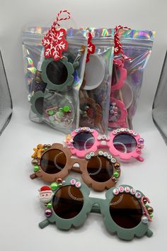 three pairs of sunglasses sitting next to each other