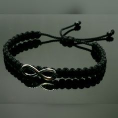 Fashionable And Durable Hand-Made Black String Bracelet With An Infinity For Wrist Sizes 6 To 9 Inches, With An Easy To Use Zip Like Function To Fit Your Wrist, You'll Have It On As Soon As You Get It. Made From High Quality Black String, It Will Be Sure To Last. Each Bracelet Is Carefully Handcrafted And Given Proper Time To Ensure Quality. Fast Shipping Adjustable Infinity Stainless Steel Jewelry, Black Adjustable Infinity Jewelry, Black Infinity Bracelet For Friendship, Black Infinity Friendship Bracelet, Metal Bracelet With Black Band As Gift, Adjustable Silver Stainless Steel Braided Bracelet, Trendy Silver Braided Bracelets For Friendship, Elegant Black Metal Braided Bracelets, Black Hypoallergenic Metal Bracelets