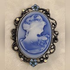 Vintage Blue Cameo Brooch With Blue & Clear Stones Blue Victorian Brooches For Formal Occasions, Blue Victorian Brooch For Formal Occasions, Victorian Blue Brooch For Formal Occasions, Elegant Blue Brooch, Blue Cameo Necklace For Formal Occasions, Elegant Blue Brooch Pins, Blue Cameo Jewelry For Wedding, Antique Cameo Brooches Collectible, Formal Cameo Brooch