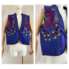 Beautiful 70s embroidered waistcoat Made from a thick cotton purple/blue fabric The front of the waistcoat is fully embroidered as a peacock  Can be closed at the front with a button UK size: 10 (m) - US: 6 EU: 38 Armpit to armpit: 48  cm - 18,9" Length: 54 cm - 21,3" Material: cotton In good vintage condition (the fabric around the shoulders and inside is a bit faded, see last pictures) This item has been washed and steamed so that there are no more odors. This item is vintage, which means 25 y Festive Vintage Fitted Vest, Fitted Bohemian Vest With Floral Embroidery, Embroidered Cotton Vest For Festival, Cotton Embroidered Vest For Festival, Fitted Folk Style Festive Vest, Festive Folk-style Fitted Vest, Fitted Folk Style Vest For Festive Season, Festive Folk Style Fitted Vest, Fitted Cotton Vest With Floral Embroidery