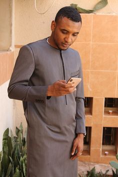 Costume Dembis | Awalebiz Marketplace Formal Fitted Long Sleeve Agbada, Traditional Fitted Agbada For Formal Occasions, Fitted Long Sleeve Agbada For Wedding, Fitted Long Sleeve Agbada For Traditional Ceremonies, Traditional Fitted Agbada With Long Sleeves, Fitted Long Sleeve Thobe For Traditional Ceremonies, Men African Fashion, Men Kaftan, African Suit