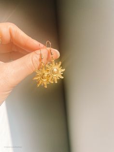 “I've been waiting for you a long time, Alina" He said. "You and I are going to change the world.” Vintage sun pendant, featuring Alina's sun summoner power, on a medium thickness silver hoop. Inspired by Leigh Bardugo's Shadow and Bone trilogy / Grishaverse. When the sun hits these earrings watch Alina's power come to life! Want a matching set? Check out The Sankta Alina Vintage necklace. Readers Society has a ton of fun Grisha based items for you to discover. Celestial Single Earring For Everyday Wear, Celestial Drop Earrings For Everyday, Everyday Celestial Drop Earrings, Celestial Metal Jewelry, Silver Jewelry For Everyday Summer Wear, Gold Dangle Jewelry For Summer, Summer Jewelry For Pierced Ears As A Gift, Gold Sterling Silver Jewelry For Summer, Summer Gift Jewelry For Pierced Ears