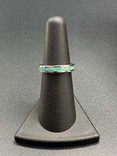 This beautiful handcrafted Stainless Steel comfort band is a real conversation starter! It features a Spring Green Opal inlay in the center of the ring. The crushed Opal is placed by hand, incased in resin, and then finished and polished to a brilliant shine. Each ring I make is truly unique and no two are ever the same. These rings are made to order and are available in several sizes. Use the drop down boxes to choose your ring size and width. Please allow 3-5 days for me to complete your ring. Artisan Rings With Inlay For Anniversary, Adjustable Turquoise Ring With Inlay For Gift, Adjustable Inlay Jewelry Ring, Green Inlay Rings For Anniversary, Adjustable Patina Jewelry For Anniversary, Green Anniversary Rings With Inlay, Anniversary Green Inlay Rings, Artisan Rings With Patina And Adjustable Fit, Real Conversation