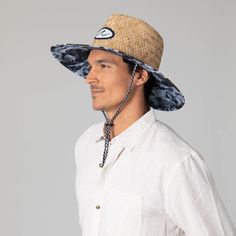 Choose the Mens Straw Lifeguard with Ocean Wave Under-brim, a stylish hat perfect for a day by the beach. Finessed from 100% straw with a 4.5" brim, featuring a unique wave print under-brim, damask woven wave patch, and a pinch crown. UPF 50+ sun protection ensures the safe wear of this fashionable, tropical lifeguard hat. Features: Color: BlueMaterials: 100% StrawBrim Size: 4.5" BrimSize: 59cmSun Protection: UPF 50+ Casual Woven Brimmed Sun Hat, Uv Protection Panama Hat With Curved Brim, Casual Natural Straw Hat For The Pool, Casual Curved Brim Sun Hat For Warm Weather, Casual Natural Straw Hat For Pool, Casual Straw Brimmed Sun Hat, Casual Woven Straw Hat With Curved Brim, Straw Sun Hat With Upf 50+ For Pool, Straw Bucket Hat With Upf 50+ And Curved Brim