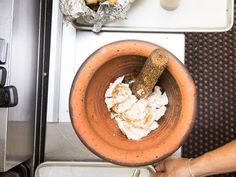 a person is mixing something in a bowl