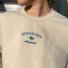 *SIZES ARE UNISEX* -I'd suggest your usual size for a more fitted look, or sizing up for a more relaxed fit. *these sweatshirts are extra comfy when oversized 🐢 "Ocean City Maryland" with a turtle embroidered on a comfy vintage-style crewneck. Perfect for any occasion or gift for him or her. A sturdy and warm sweatshirt bound to keep you warm in the colder months. A pre-shrunk, classic fit sweater that's made with air-jet spun yarn for a soft feel and reduced pilling. Your new favorite sweatshi Casual Long Sleeve T-shirt With Embroidered Logo, Casual Crew Neck Sweater With Embroidered Logo, Casual T-shirt With Embroidered Logo For Winter, Casual Winter T-shirt With Embroidered Logo, Casual Embroidered Logo T-shirt For Fall, Casual Fall T-shirt With Embroidered Logo, Casual Embroidered Crew T-shirt, Casual Winter T-shirt With Embroidered Text, Casual Oversized Sweater With Embroidered Logo