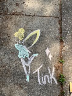 a sidewalk with chalk drawings on it that says talk and a tennis racquet