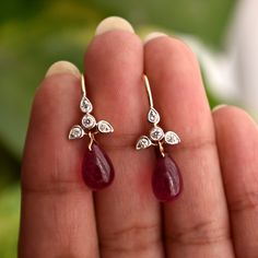 A perfect pair for your big day or the most important ladies of your tribe, these pretty earrings feature a cluster of diamond studded leaves with a Natural Ruby Drop * Diamond Wt. : 0.20 Cts * Color-Clarity Grade : H-I, VS Si * Ruby : 7 ct ( Approx) * Gold - 14K, 1.6 gms yellow gold (for other metal color, please convo) Find us on Instagram for exquisite designs: @abhikajewels Like us on Facebook: www.facebook.com/Abhikajewels Thank you for visiting our shop.. :) Fine Jewelry Dangle Earrings With Single Cut Diamonds, Dangle Diamond Earrings With Single Cut Diamonds For Wedding, Dangle Diamond Earrings With Single Cut For Wedding, Wedding Diamond Dangle Earrings With Single Cut Diamonds, Wedding Dangle Diamond Earrings With Single Cut Diamonds, Diamond Teardrop Bridal Earrings With Gemstone, Teardrop Diamond Bridal Earrings With Gemstone, Diamond Briolette Earrings For Anniversary, Pear-shaped Diamond Earrings With Gemstones