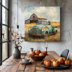 an old truck is sitting in the middle of a table with apples and pumpkins