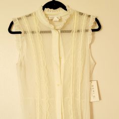 Sleeveless Sheer Blouse W/ Lace & Ruffle Detail Ivory Geri C New York Size Xl Tags On Elegant Sleeveless Sheer Blouse, Sheer Sleeveless Blouse For Spring, Sleeveless Lace Top For Spring Daywear, Sheer Sleeveless Beige Top, Sleeveless Sheer Beige Tops, Summer Sleeveless Lace Top With Ruffles, Beige Sheer Sleeveless Top, Sheer Sleeveless Lace Top For Summer, Feminine Sleeveless Lace Top For Daywear