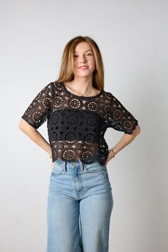 This cute and on trend black crochet top will be your new favorite top. We love the open knit design. It features a wide circle neckline with a black bandeau underneath and short sleeves. Pair with your favorite denim jeans or dress it up with a mini skirt. *Materials: Self- 100% Polyester. Lining- 95% Rayon, 5% Spandex Size & Fit: Materials: Self - 100% polyester, Lining - 95% Rayon, 5% Spandex Fit: This top is true to size. Jessi is wearing a size small.Length: The length hits below the natura Crochet Trim Top With Short Sleeves For Day Out, Crochet Trim Short Sleeve Top For Day Out, Crochet Top With Crochet Trim For A Day Out, Lace Crochet Top With Short Sleeves, Short Sleeve Open Knit Crochet Top, Lace Crochet Open Knit Top With Short Sleeves, Casual Crochet Top With Open Knit And Short Sleeves, Spring Pointelle Knit Tops For Night Out, Crochet Lace Top With Short Sleeves