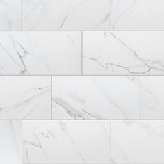 a white marble tile wall that looks like it has been cleaned