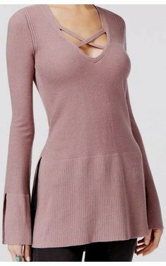 Brand new, never worn, tunic sweater from Free People.  Size XS in mauve, also featuring a crisscross detail at the neckline.  Super cute, just doesn't look right on me!  Super clean with no rips, tears, or stains.  Comes from a smoke free home.  Please check out all of the pics for condition.  Bid with confidence as we offer a money back guarantee on all of our items! Mauve V-neck Top For Fall, Chic Mauve Tops For Fall, Fitted V-neck Knit Top For Fall, Fitted Mauve Top For Fall, Mauve Long Sleeve Sweater For Fall, Chic Fitted Mauve Tops, Fitted V-neck Loungewear Sweater, Fitted V-neck Knit Top For Loungewear, Fitted Chic Mauve Tops