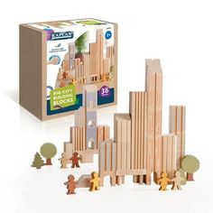 a wooden city block set in front of a cardboard box